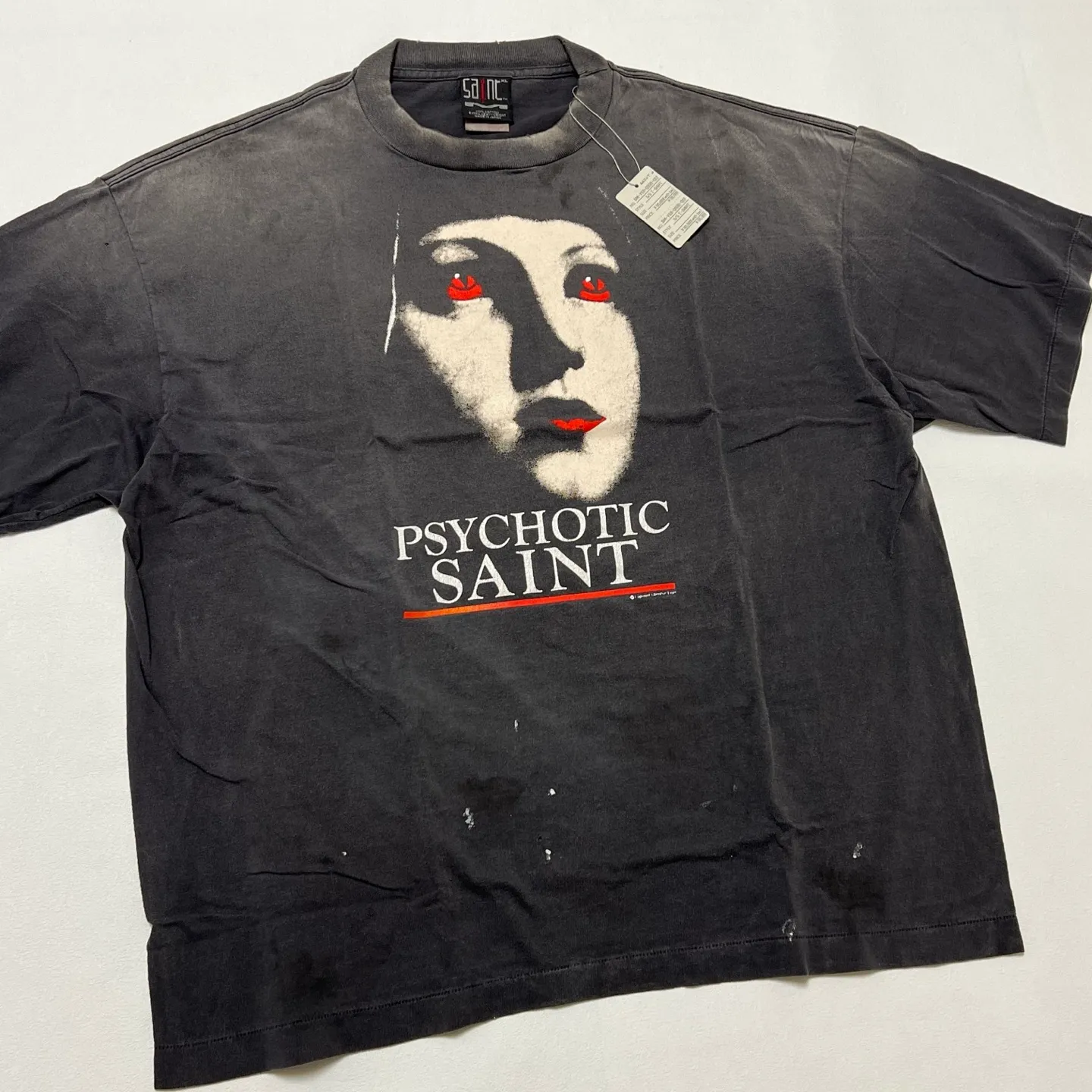SAINT Mxxxxxx SS TEE/PSYCHOTIC SNT/BLK Gothic heavy metal rock style retro short-sleeved Mysterious woman's face printed distressed TEE Washed black S-XL Same as the original version Cylindrical side seam OE yarn fabric Garment dyeing Faded by heavy washing Bust plaster faded Correct version Matching of original accessories